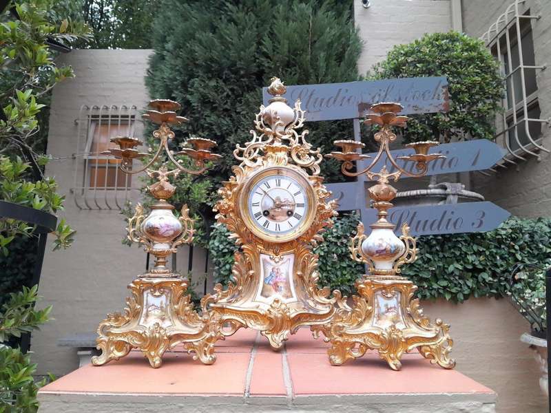 An Antique Century French Rococo Style Clock Garniture Set with Pair of Candelabras  with  Pend...