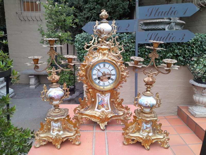 An Antique Century French Rococo Style Clock Garniture Set with Pair of Candelabras  with  Pend...