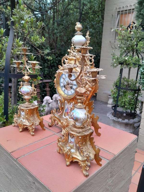 An Antique Century French Rococo Style Clock Garniture Set with Pair of Candelabras  with  Pend...