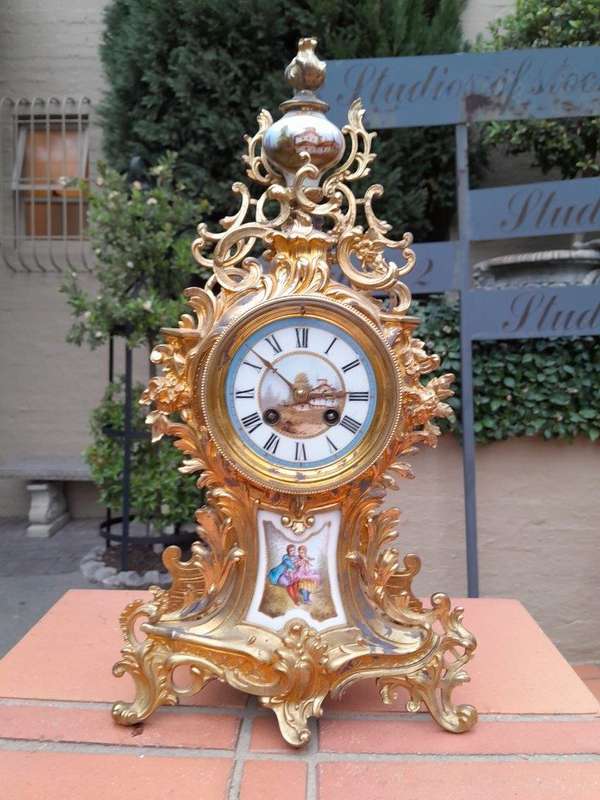 An Antique Century French Rococo Style Clock Garniture Set with Pair of Candelabras  with  Pend...