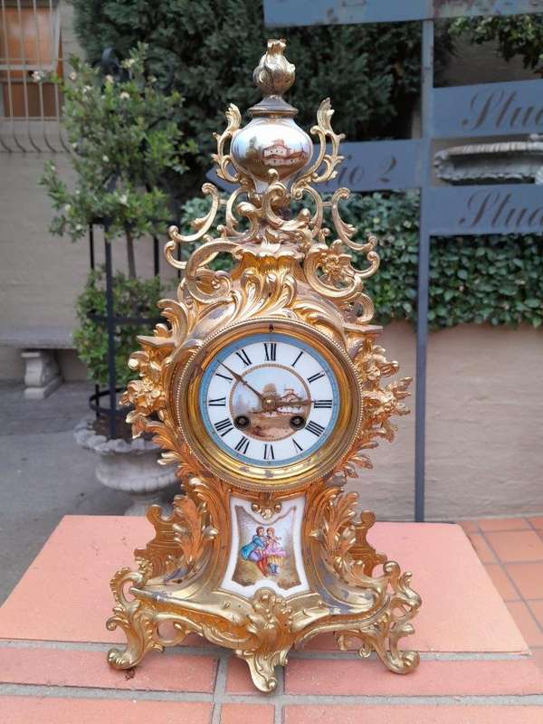 An Antique Century French Rococo Style Clock Garniture Set with Pair of Candelabras  with  Pend...