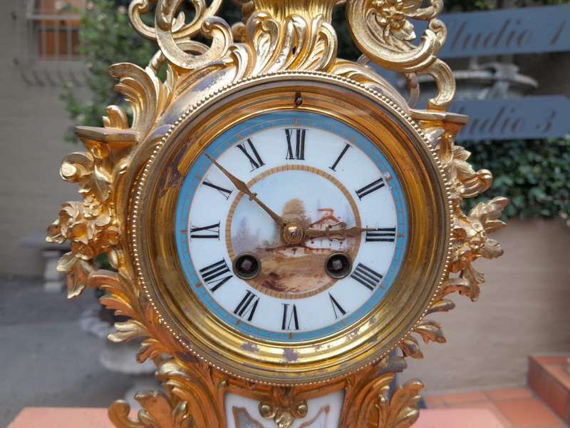 An Antique Century French Rococo Style Clock Garniture Set with Pair of Candelabras  with  Pend...