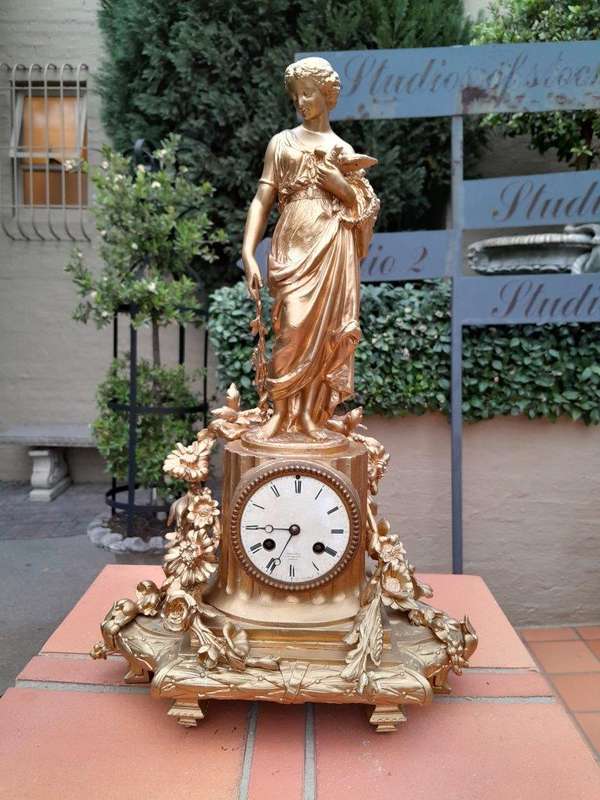 An Antique French Louis XVI Figural Clock with Pendulum and Key