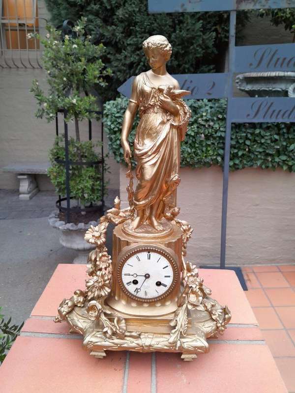 An Antique French Louis XVI Figural Clock with Pendulum and Key