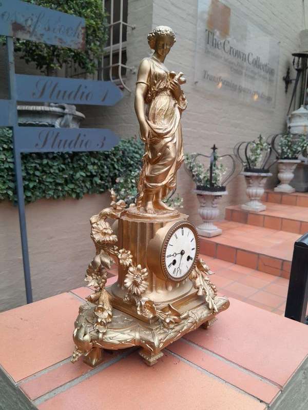 An Antique French Louis XVI Figural Clock with Pendulum and Key