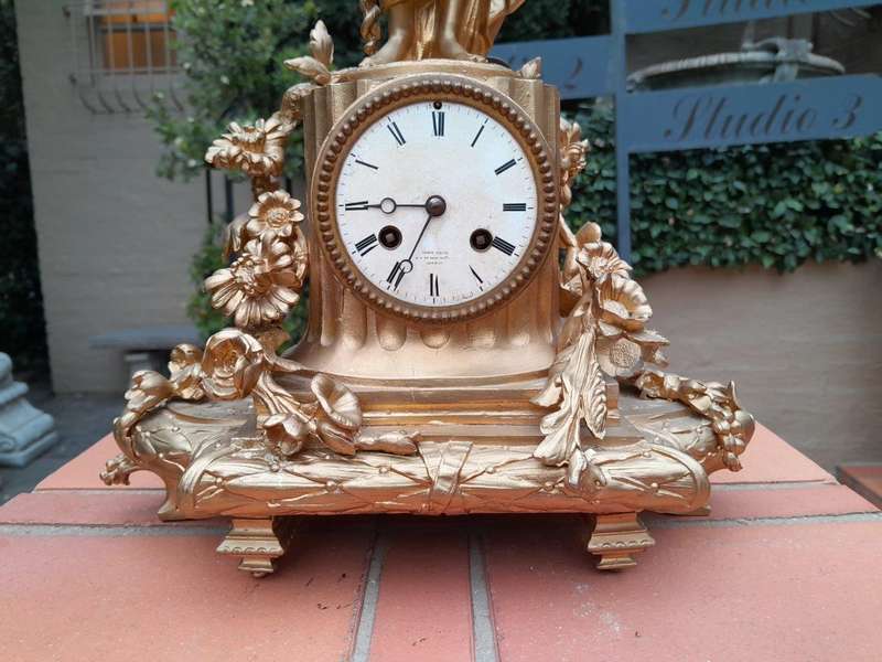 An Antique French Louis XVI Figural Clock with Pendulum and Key