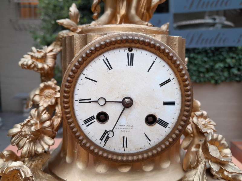 An Antique French Louis XVI Figural Clock with Pendulum and Key