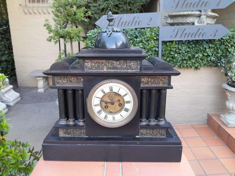 An Antique French Black Slate And Marble Clock