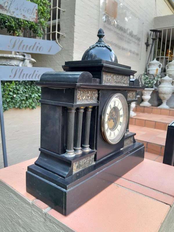An Antique French Black Slate And Marble Clock