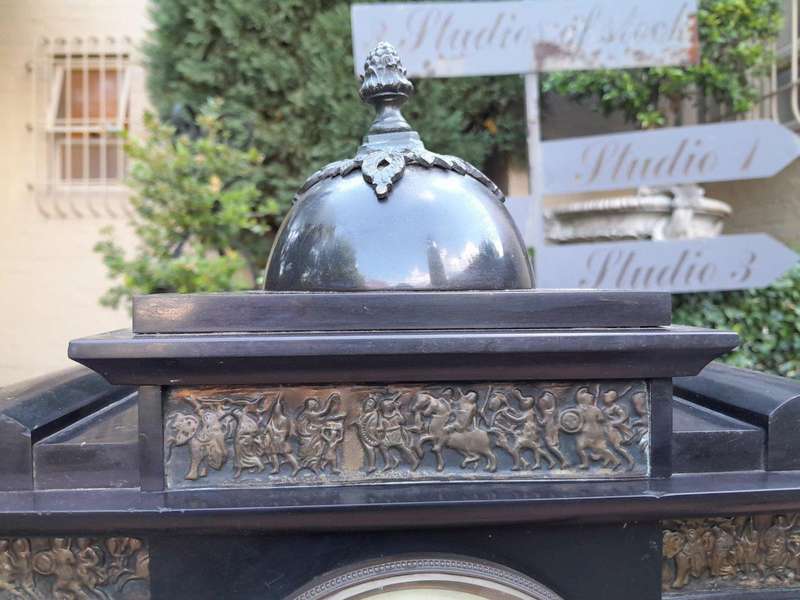 An Antique French Black Slate And Marble Clock