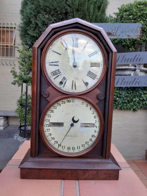 An Antique Late 19th Century Mahogany Calendar Clock With Date And Time Dials