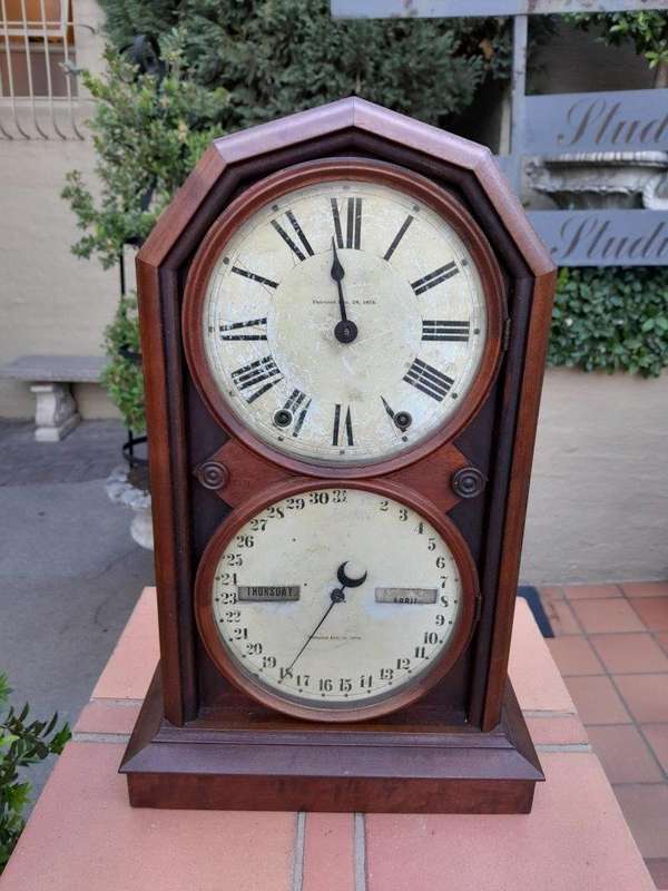 An Antique Late 19th Century Mahogany Calendar Clock With Date And Time Dials