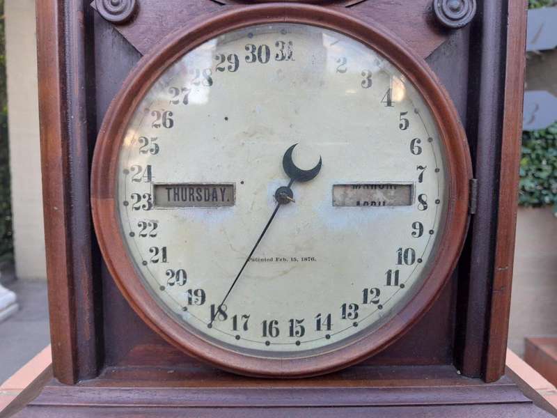 An Antique Late 19th Century Mahogany Calendar Clock With Date And Time Dials