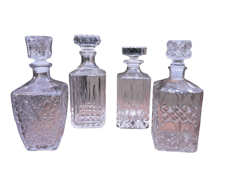 A Set Of Two Crystal Decanters And Two Cut Glass Decanters