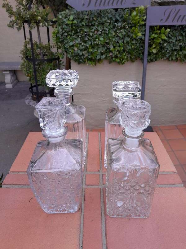 A Set Of Two Crystal Decanters And Two Cut Glass Decanters