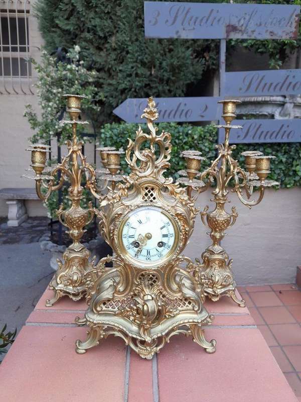 An Antique 19th Century French Rococo Gilt Ormolu Clock Garniture Set with a  Pair of Matching C...