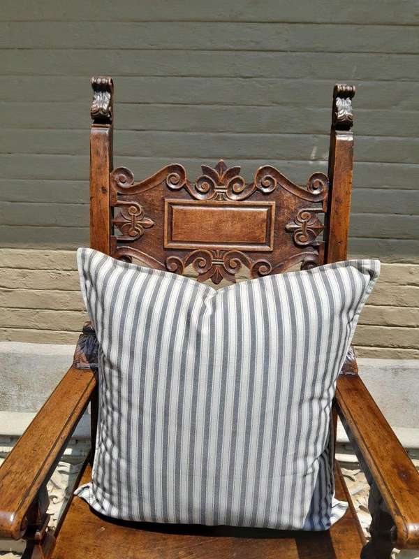 A Grey & White Stripped Cushion