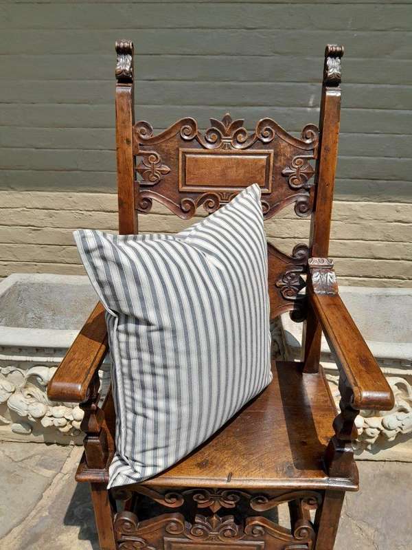 A Grey & White Stripped Cushion