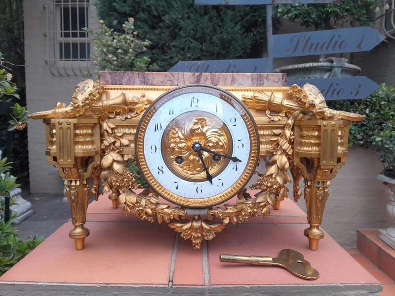 A 19th Century French Gilt Metal with Marble Top Clock