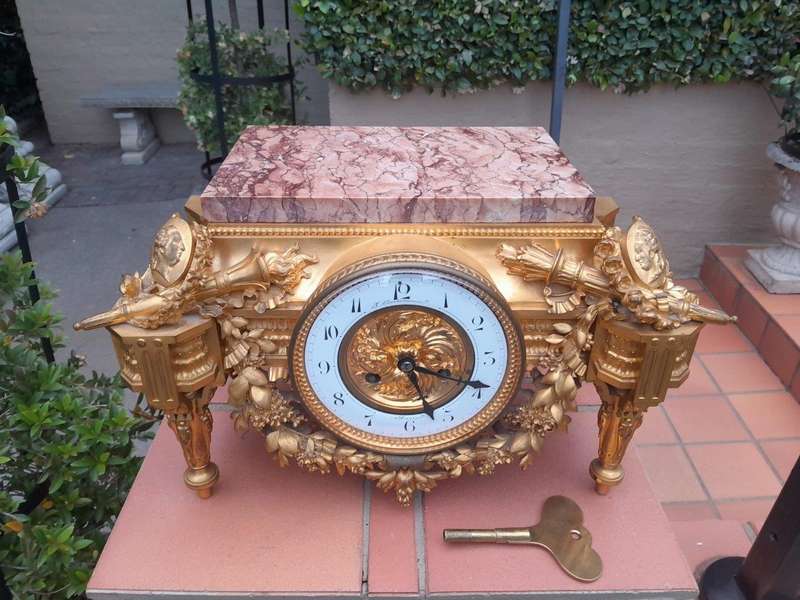 A 19th Century French Gilt Metal with Marble Top Clock