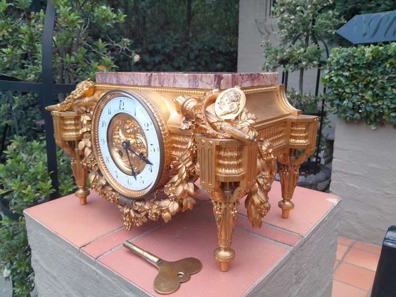 A 19th Century French Gilt Metal with Marble Top Clock