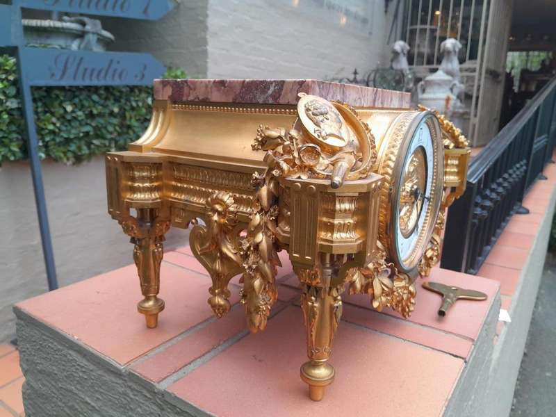 A 19th Century French Gilt Metal with Marble Top Clock