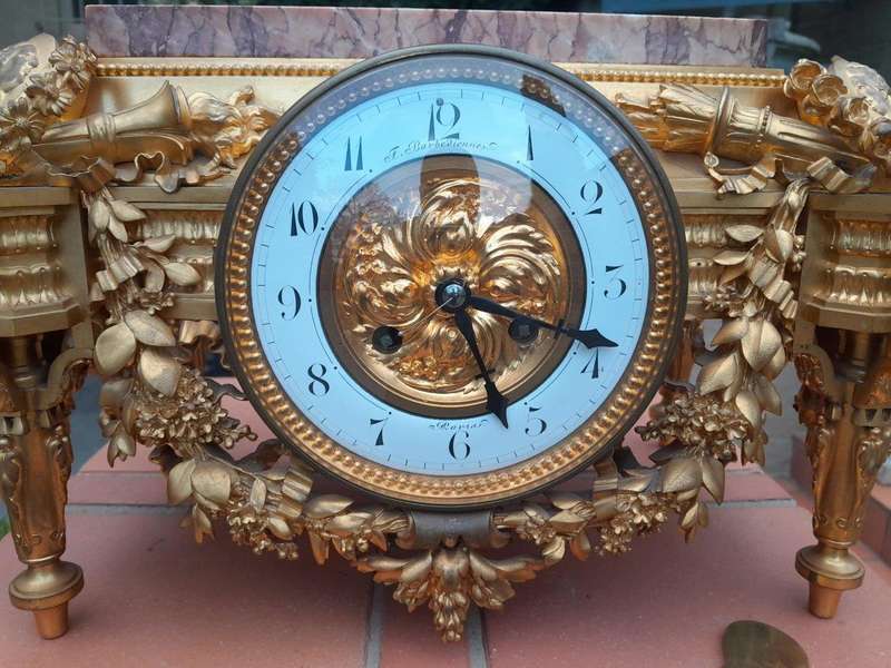 A 19th Century French Gilt Metal with Marble Top Clock