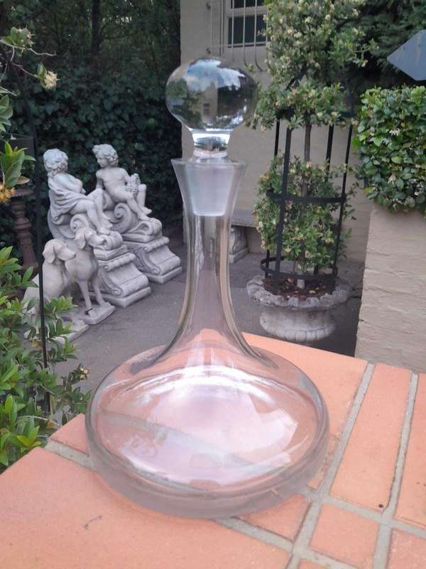 A Set of Three Glass Decanters