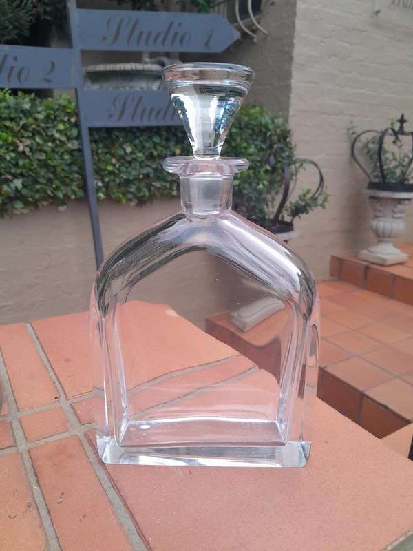 A Set of Three Glass Decanters