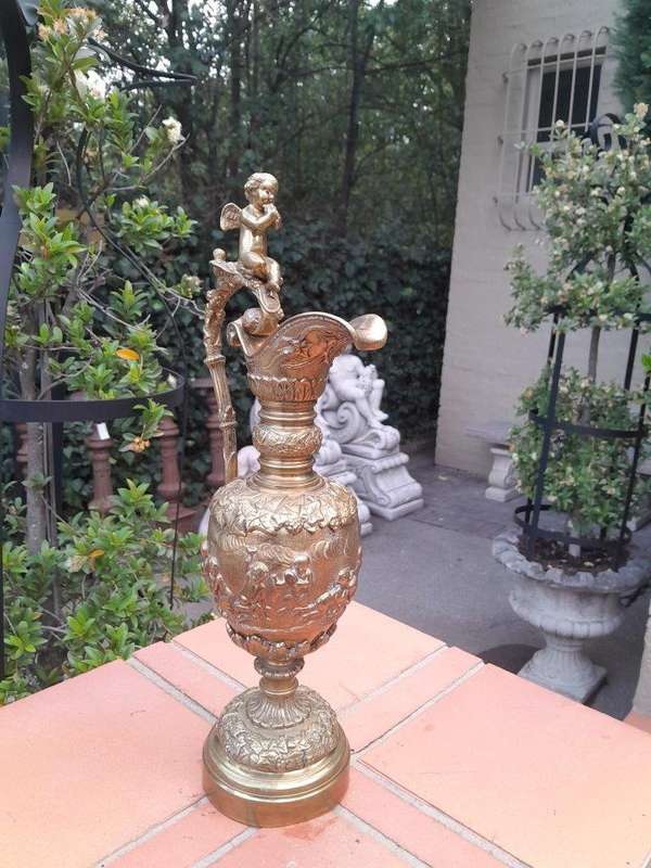A Bronze Urn with Cherub