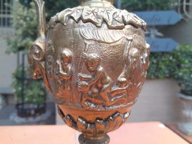 A Bronze Urn with Cherub