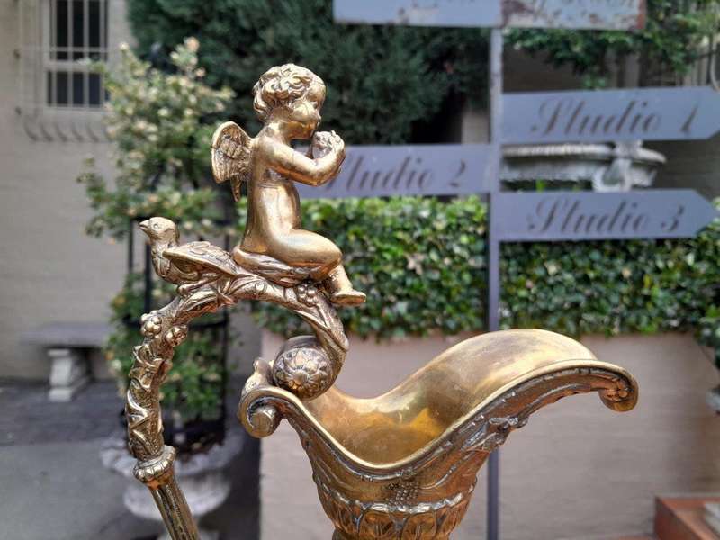 A Bronze Urn with Cherub