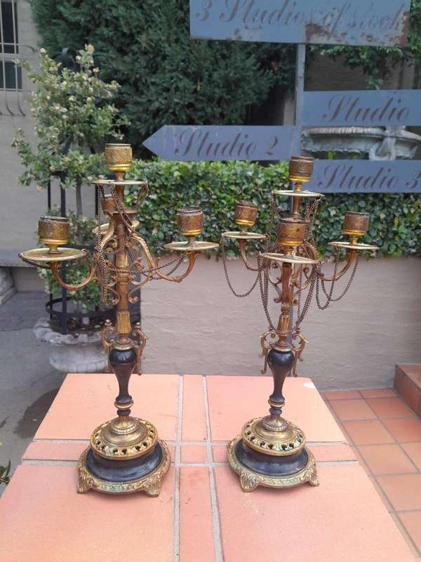 A Pair of Brass and Composite Candelabra