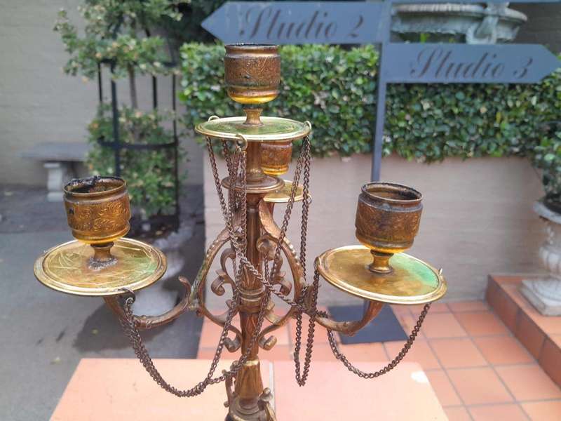 A Pair of Brass and Composite Candelabra