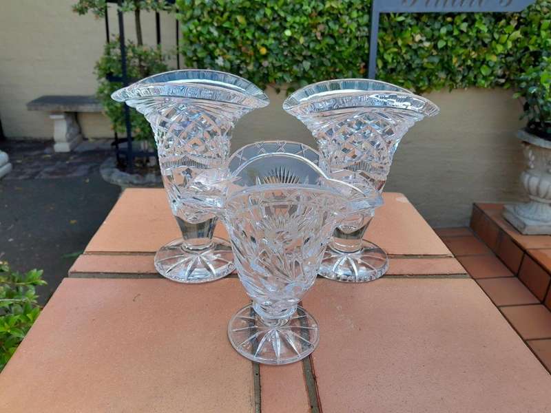 A Set of Three Cut Glass Vases