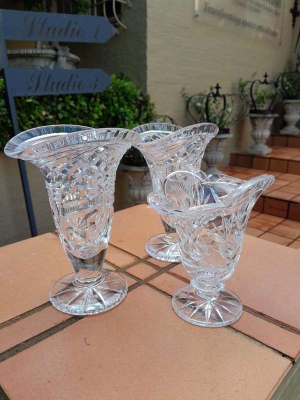 A Set of Three Cut Glass Vases
