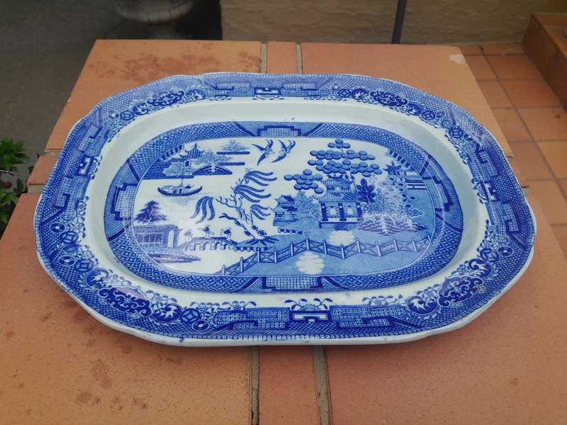An Antique Blue and White Willow Pattern Porcelain Platter