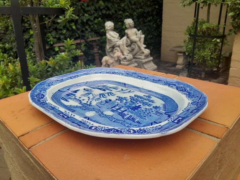 An Antique Blue and White Willow Pattern Porcelain Platter