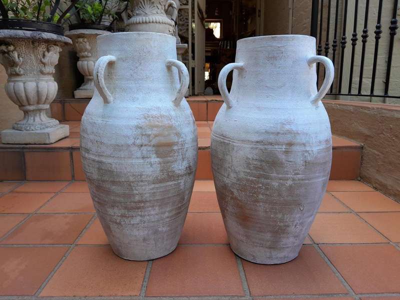 A Decorative Pair Of Cement Urns Of Large Proportion With Handles