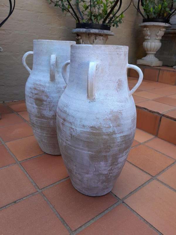 A Decorative Pair Of Cement Urns Of Large Proportion With Handles