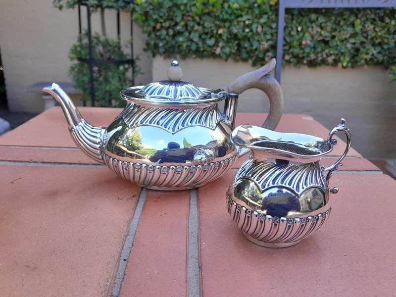 An Electroplated Silver Teapot And Milk Jug