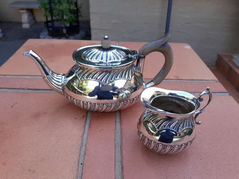 An Electroplated Silver Teapot And Milk Jug