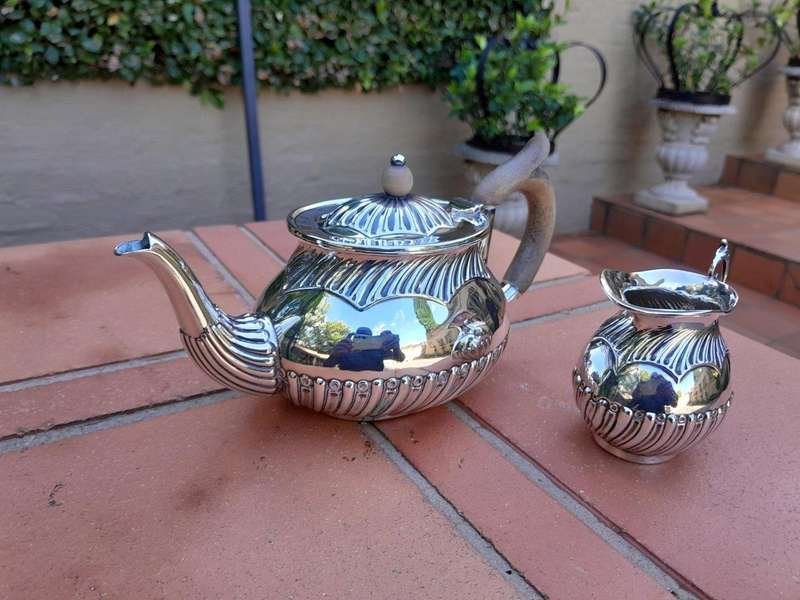 An Electroplated Silver Teapot And Milk Jug