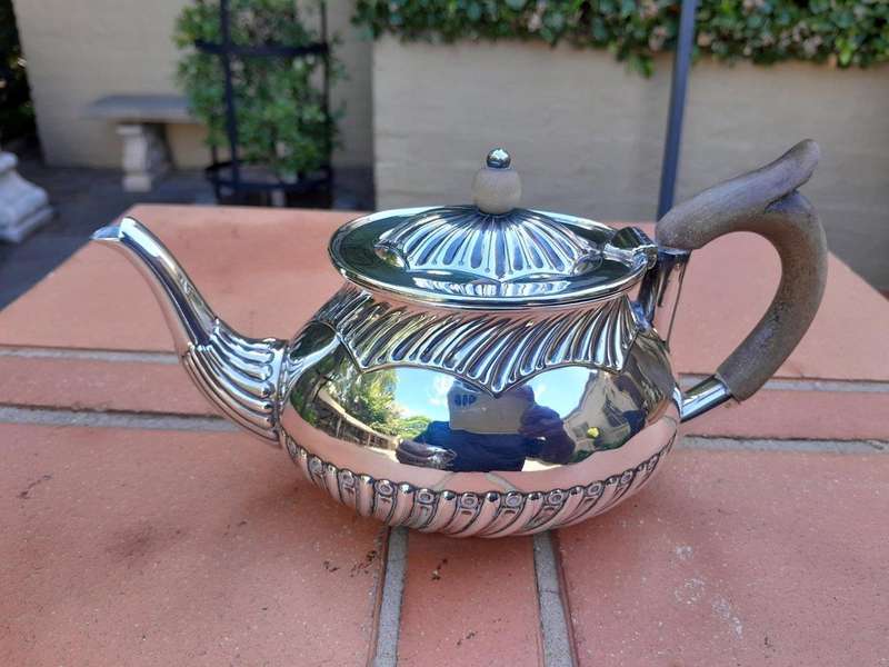 An Electroplated Silver Teapot And Milk Jug