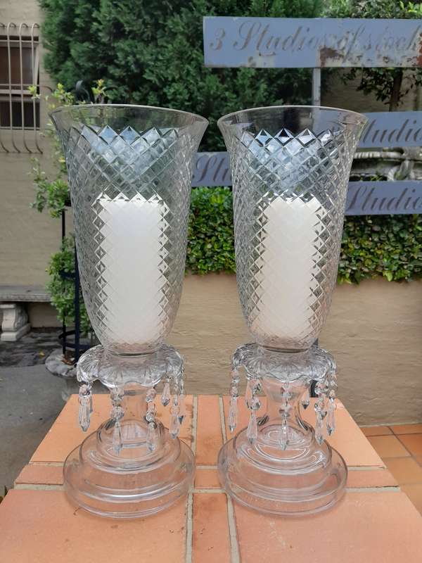 A Pair Of French Style Candle Holders With Candles