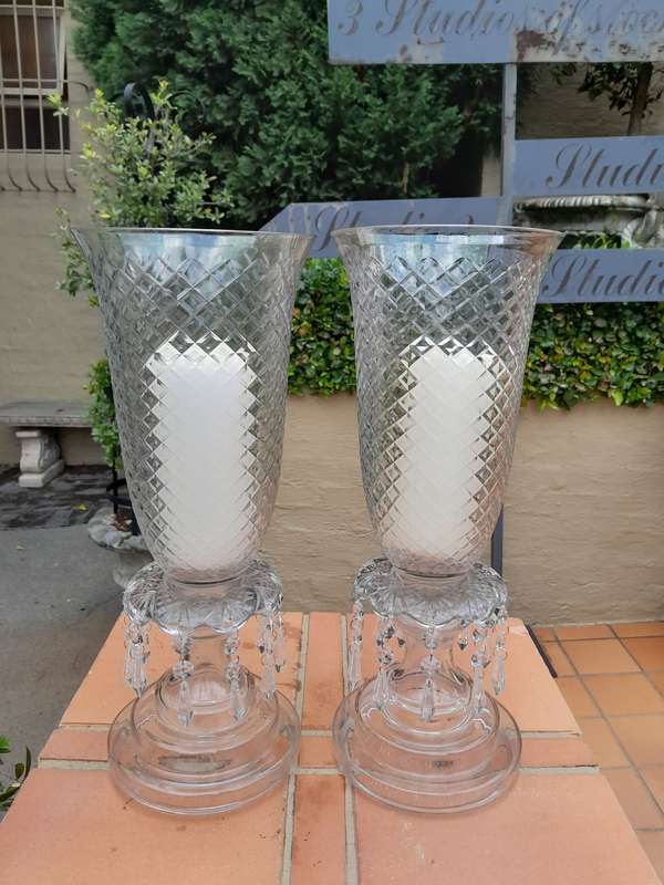 A Pair Of French Style Candle Holders With Candles