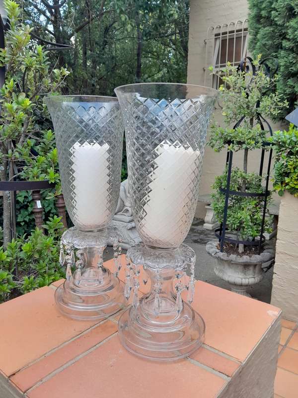 A Pair Of French Style Candle Holders With Candles