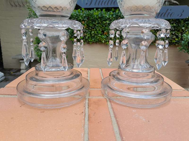A Pair Of French Style Candle Holders With Candles