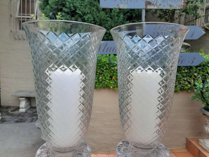 A Pair Of French Style Candle Holders With Candles