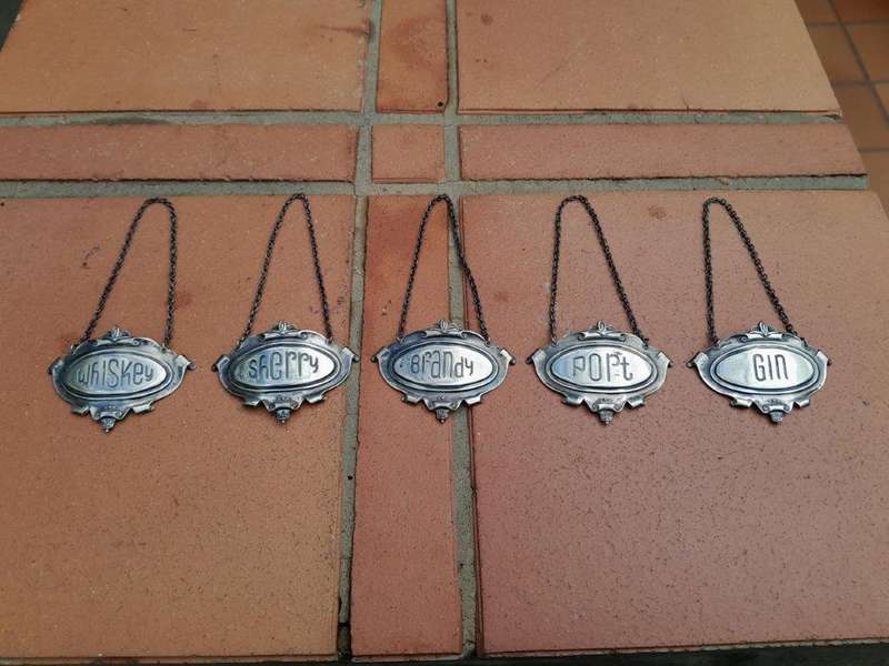 A Mid 20th Century Set of Five Sterling Silver Decanter Labels Brandy Port Sherry Gin Whisky  We...